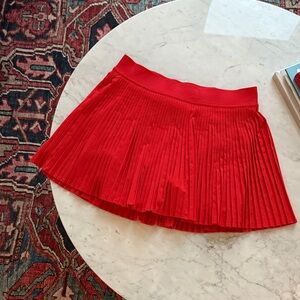 LULULEMON varsity high-rise pleated tennis skort in “hot heat”